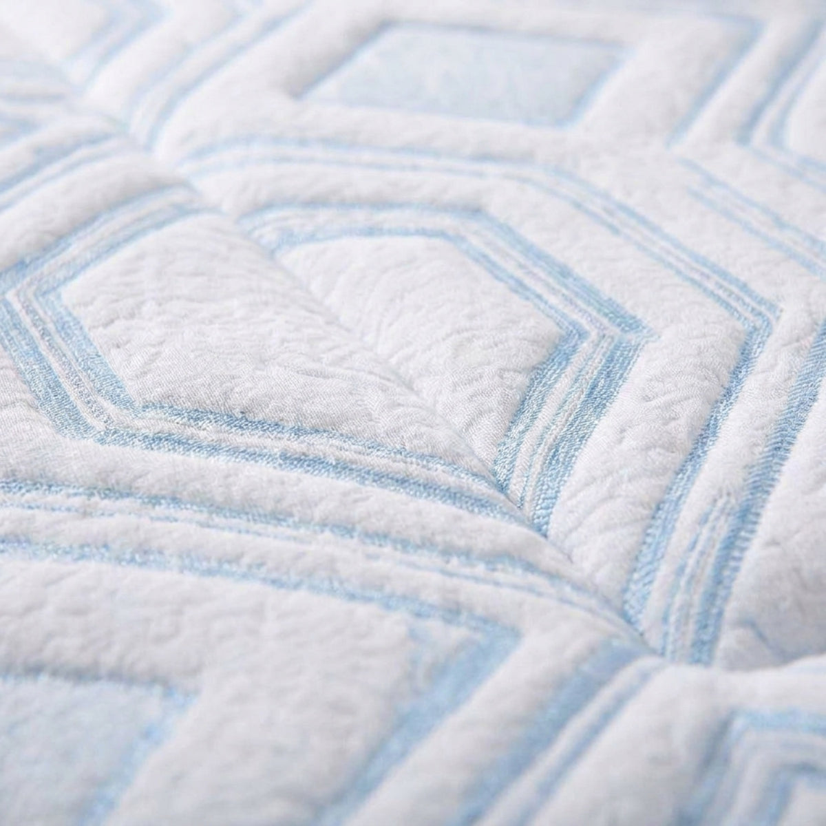 Macro of the cool-touch quilted cover fabric on the AirEdge cooling mattress topper